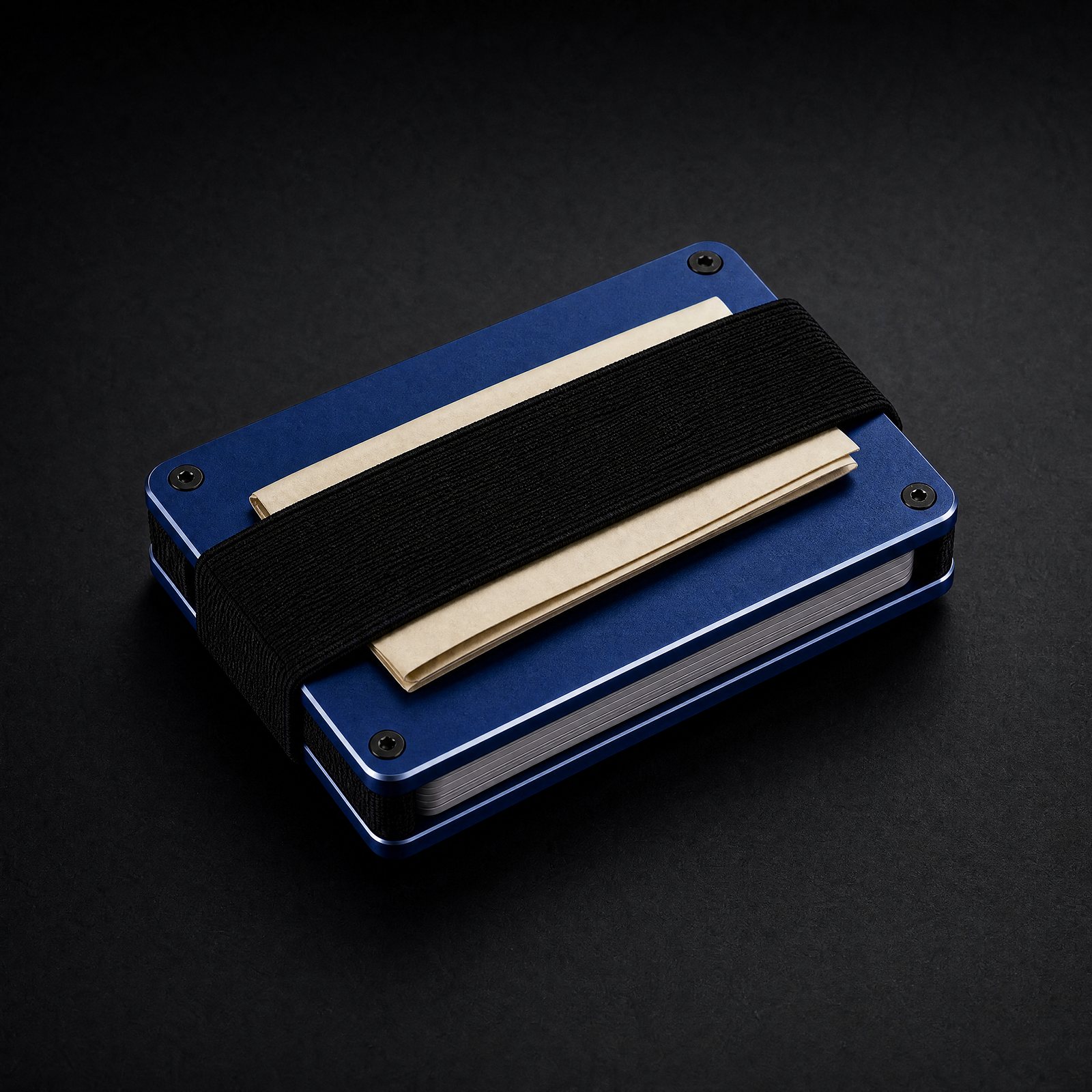Back of the cobalt ANODE wallet with the elastic cash strap holding folded bills