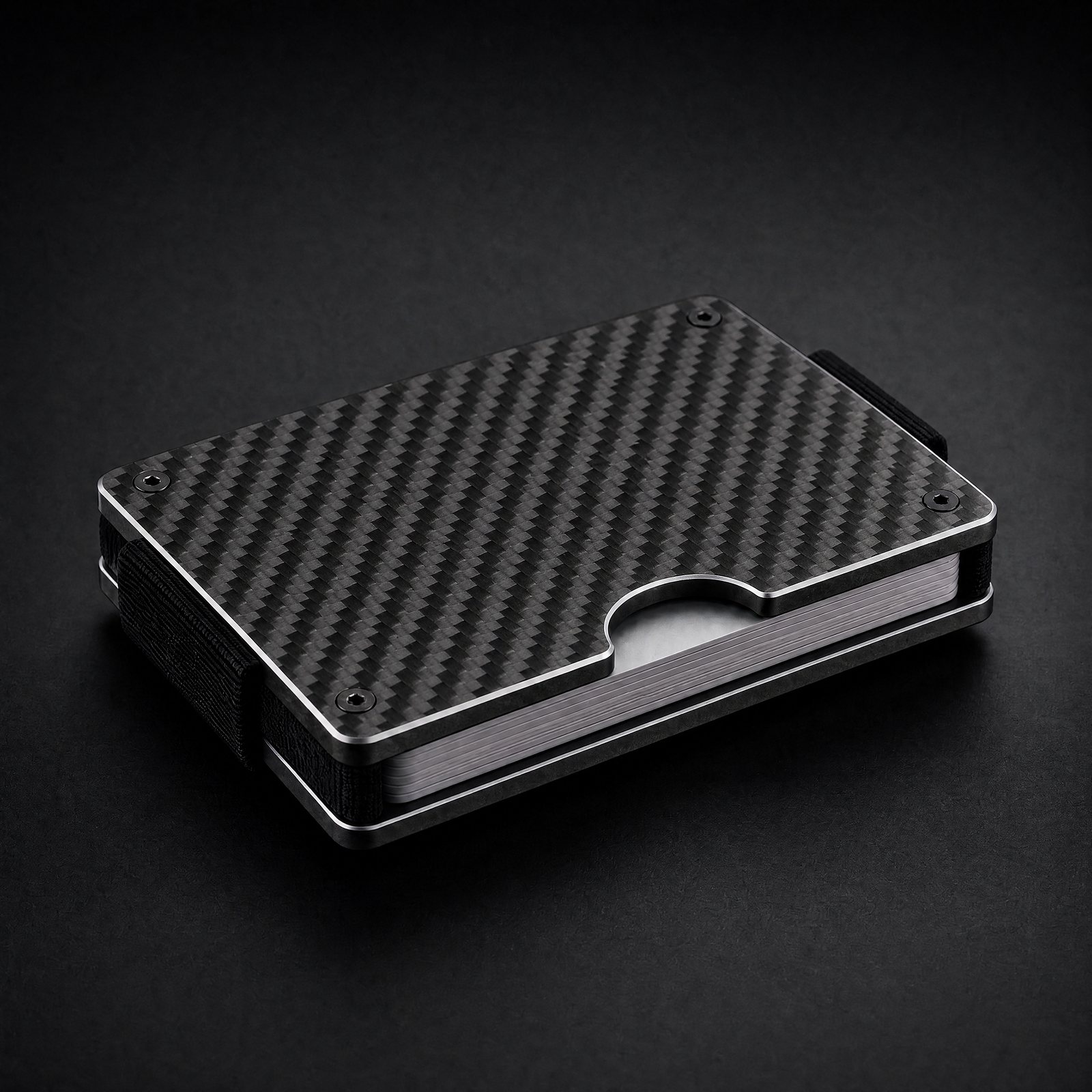 ANODE Carbon Fiber Wallet with a 3K twill weave, three quarter view with cards between the plates