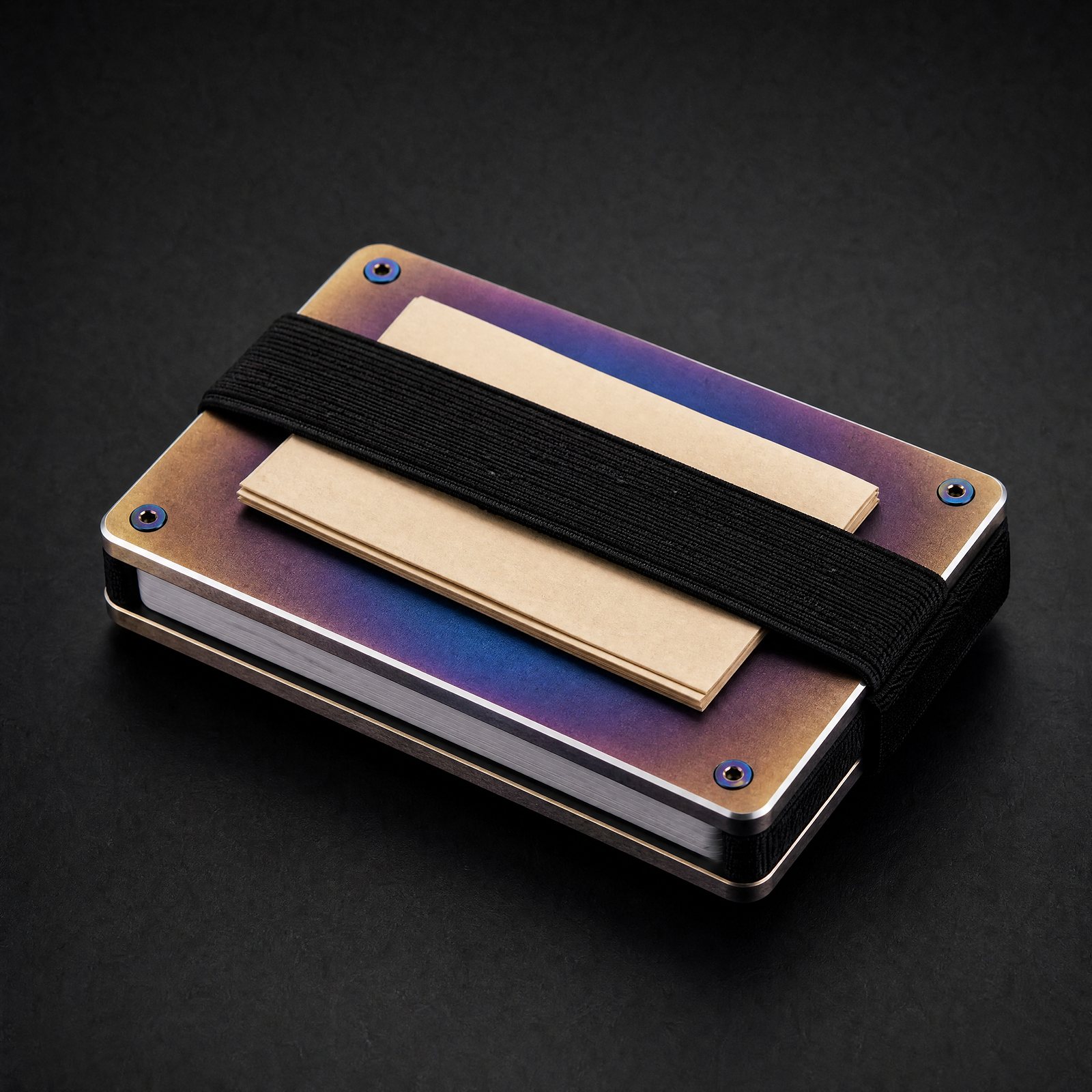 Back of the burnt titanium ANODE wallet with the cash strap holding folded bills