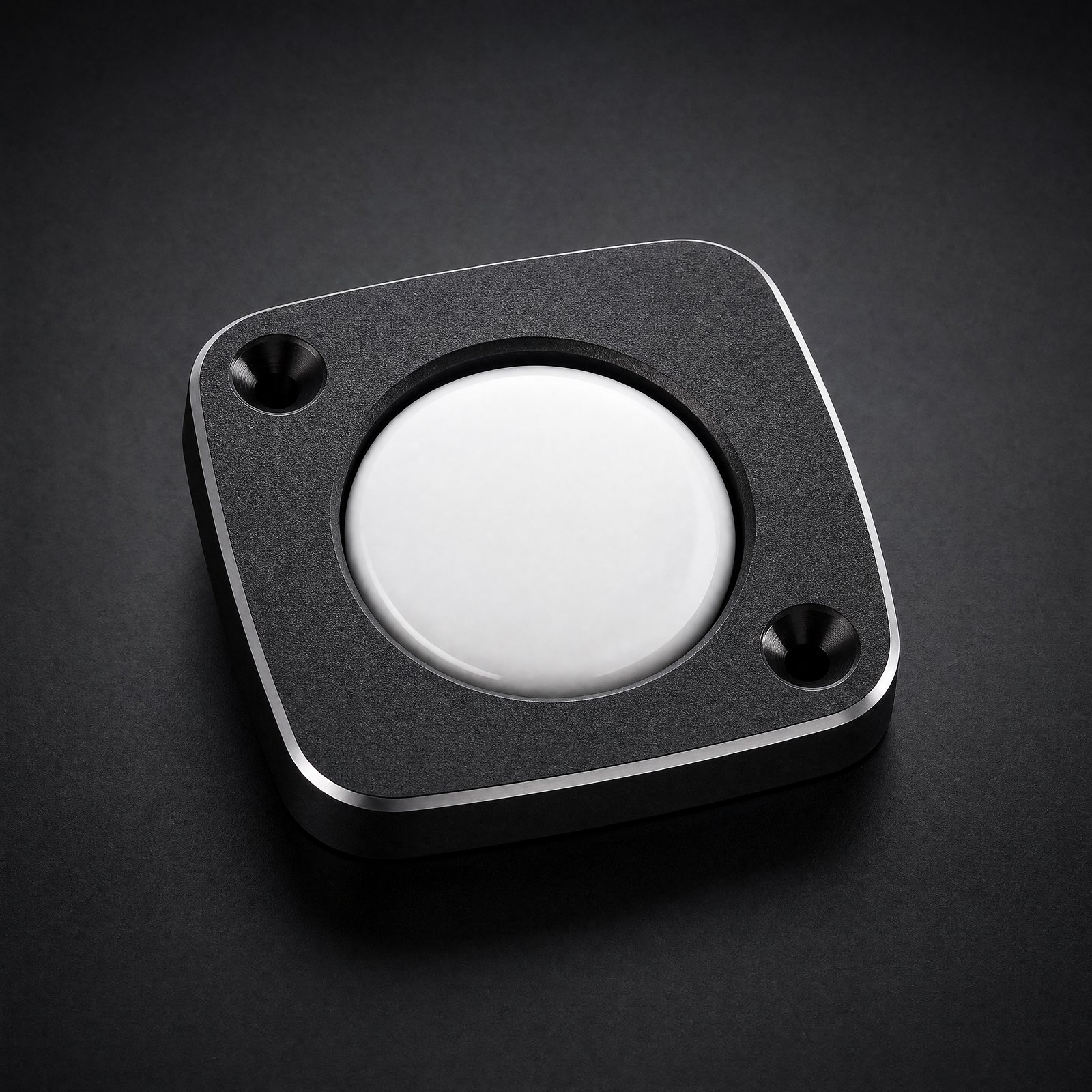 ANODE Tracker Mount in matte black aluminum holding a round tracker, three quarter view
